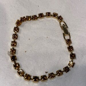 Gold plated prong set burgundy round rhinestone chain fold over clasp bracelet